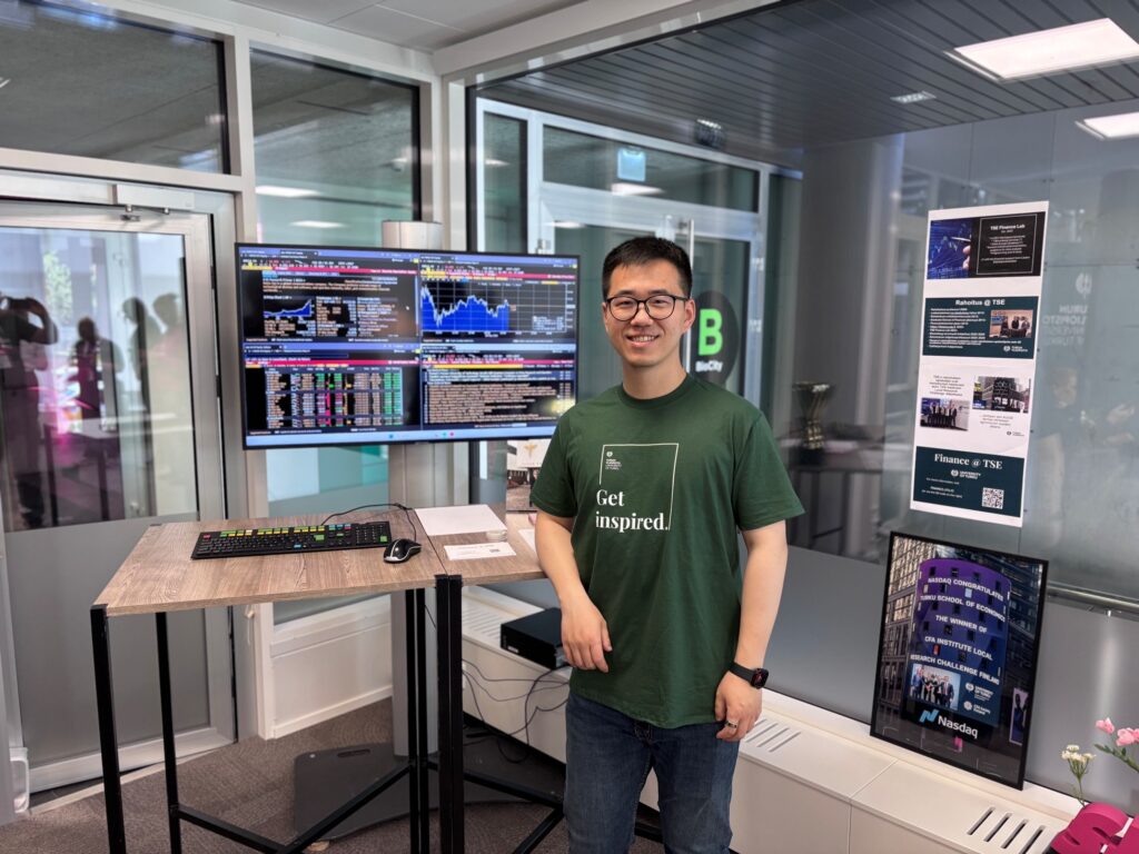 Pic of Yufeng Ding ready to answer any questions the visitors might have.